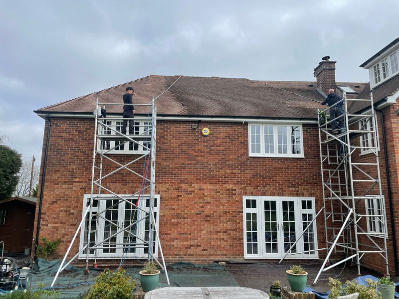 Roof cleaning carried out safely from scaffold towers by The Roof Moss Cleaners in Swindon